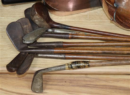 A set of eight golf clubs